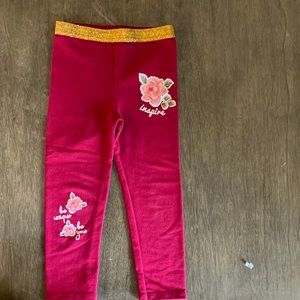 3T burgundy leggings with gold waistband.